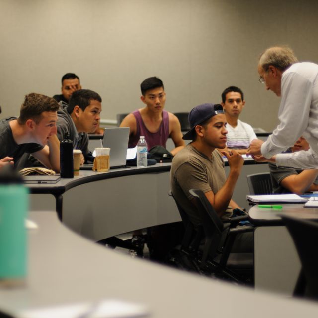 Professor talking to students