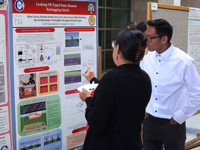 SACNAS Scholar Allan Garcia presenting his research to Ofi