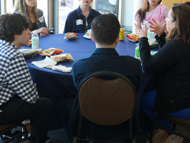 Michelle O'Malley speaking with students at the 2023 Lunch with Faculty